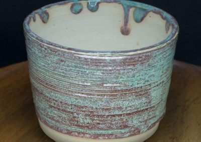 Green and dark pink grooved pot on tan clay 4"W x 3.125"H CA$20